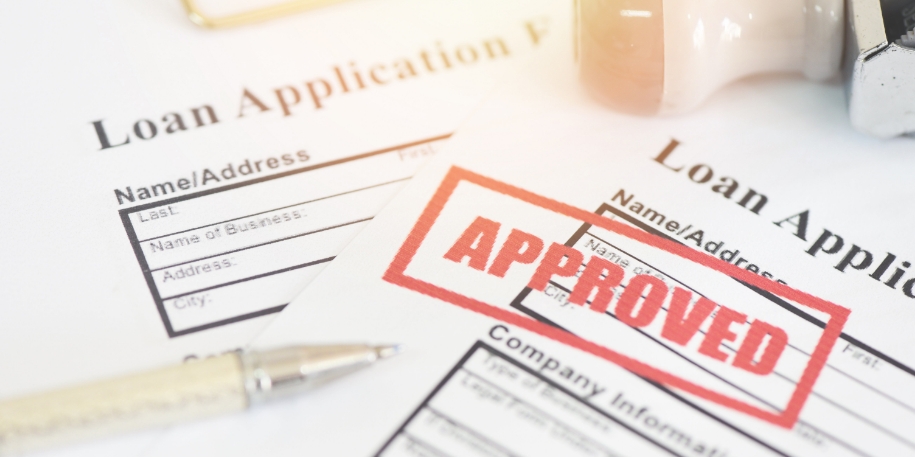loan application formed stamped with a red 'approved'