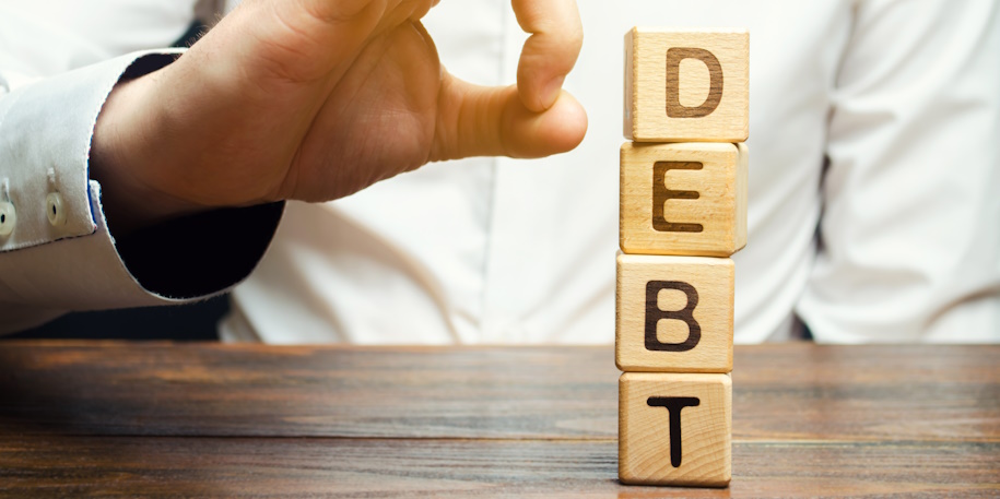 blocks spelling 'debt'