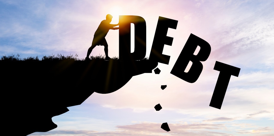illustrated man pushing word debt off cliff
