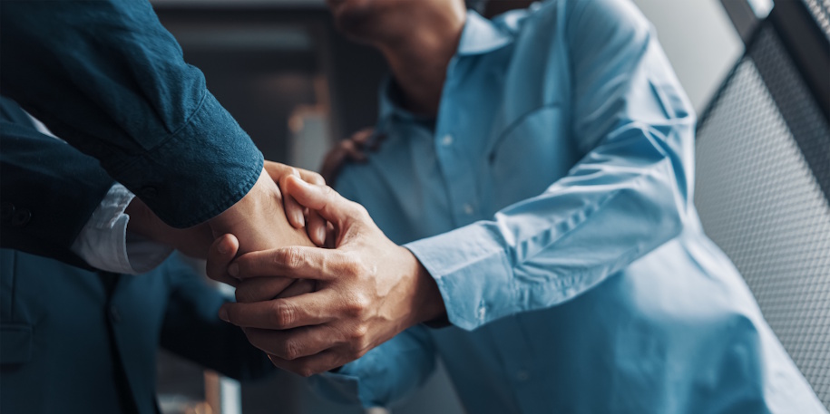 lawyer shaking client's hand